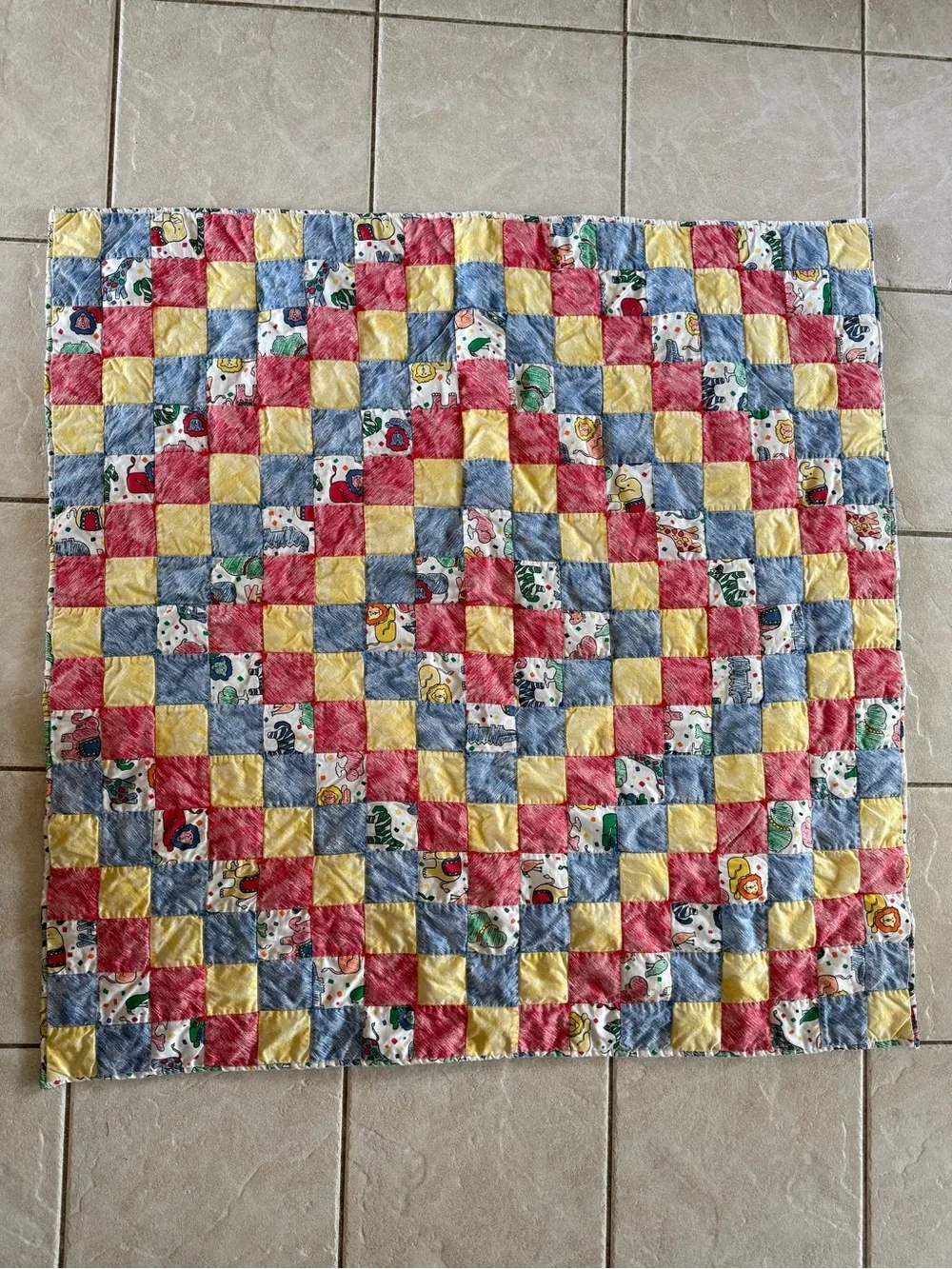 Vintage baby crib patchwork quilt with zoo animal motif